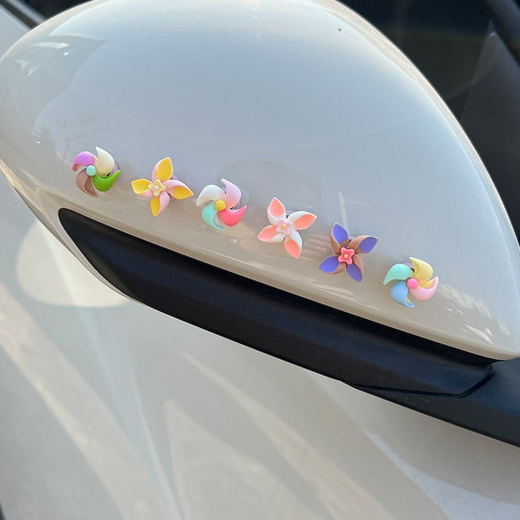 Creative decorations for the new small windmill rotating top in the car