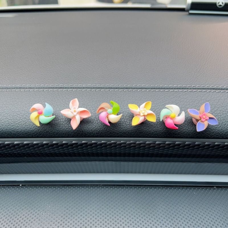 Creative decorations for the new small windmill rotating top in the car